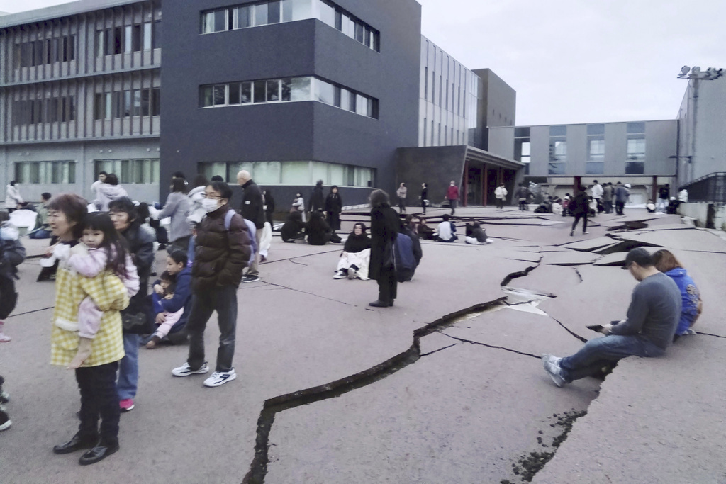 People trapped in rubble after earthquake triggers tsunami warnings