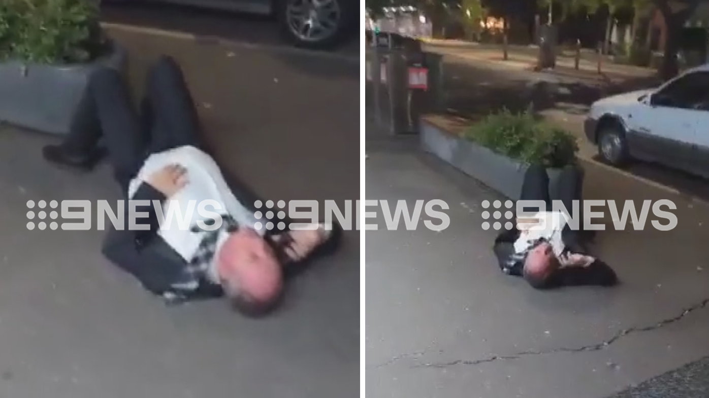Barnaby Joyce captured on video lying next to planter box