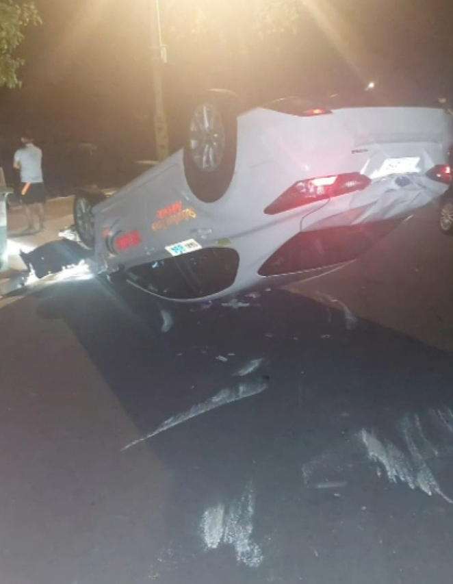 Adelaide taxi driver crashes into parked cars, flips vehicle