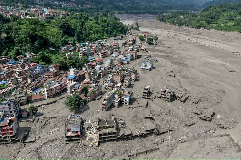 Nepal and China resume flood rescue after lake threat eases